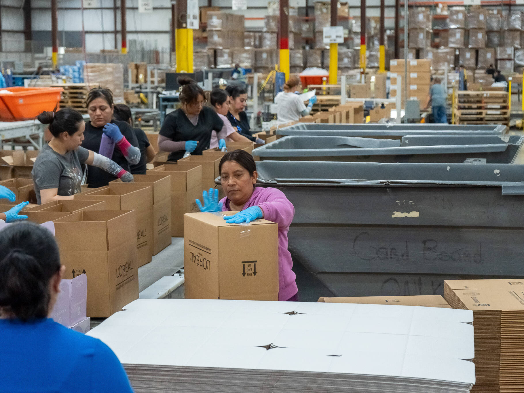 workers on packaging line